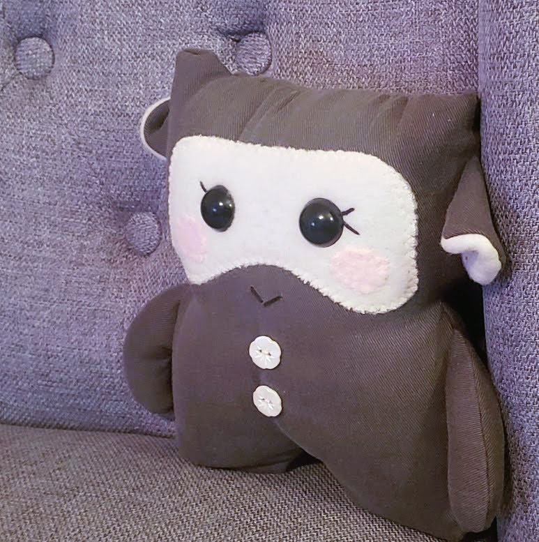 halsdoll's plush sitting on chair